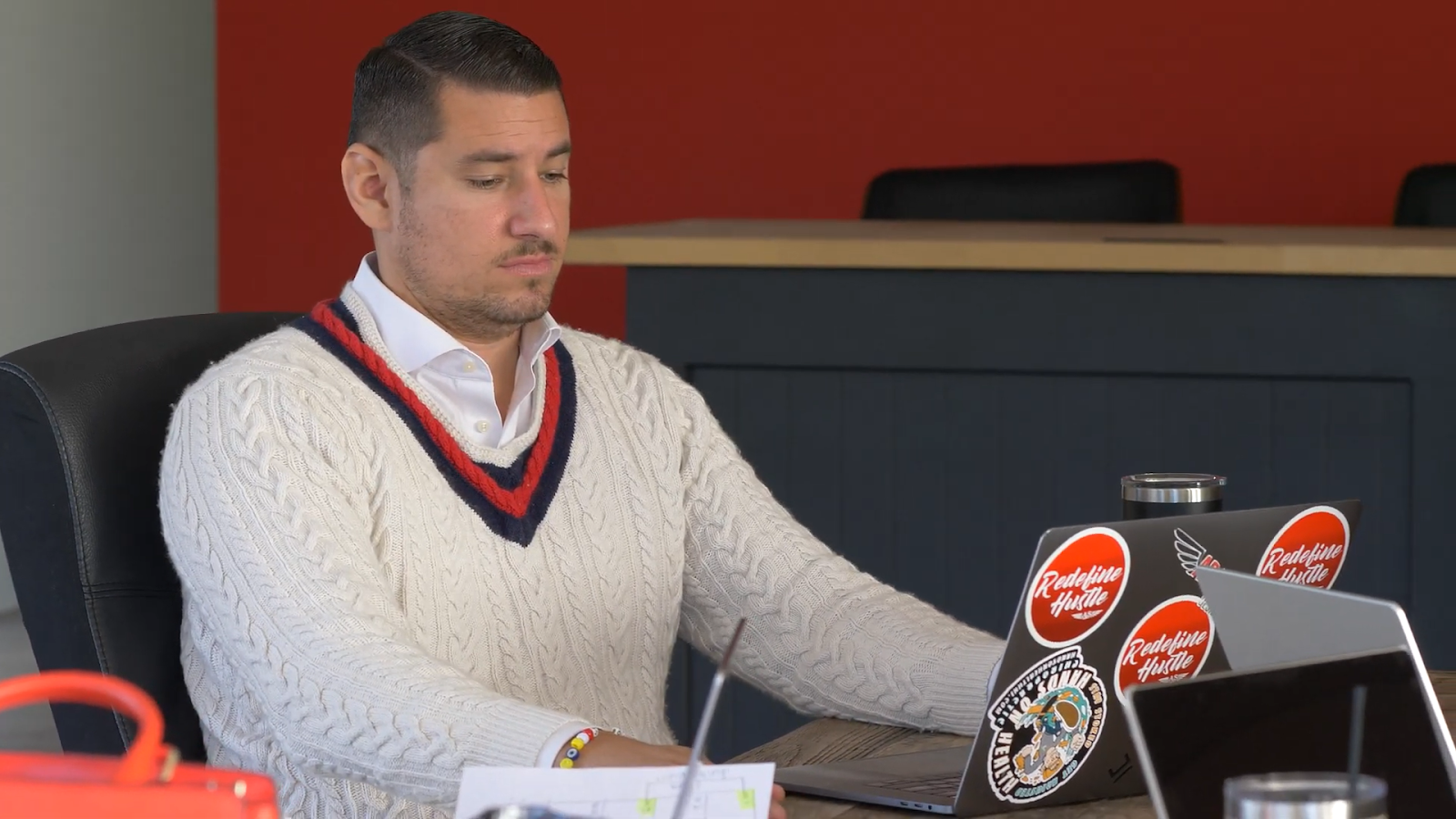 John Vagueiro working on a laptop at the Adapting Social office.