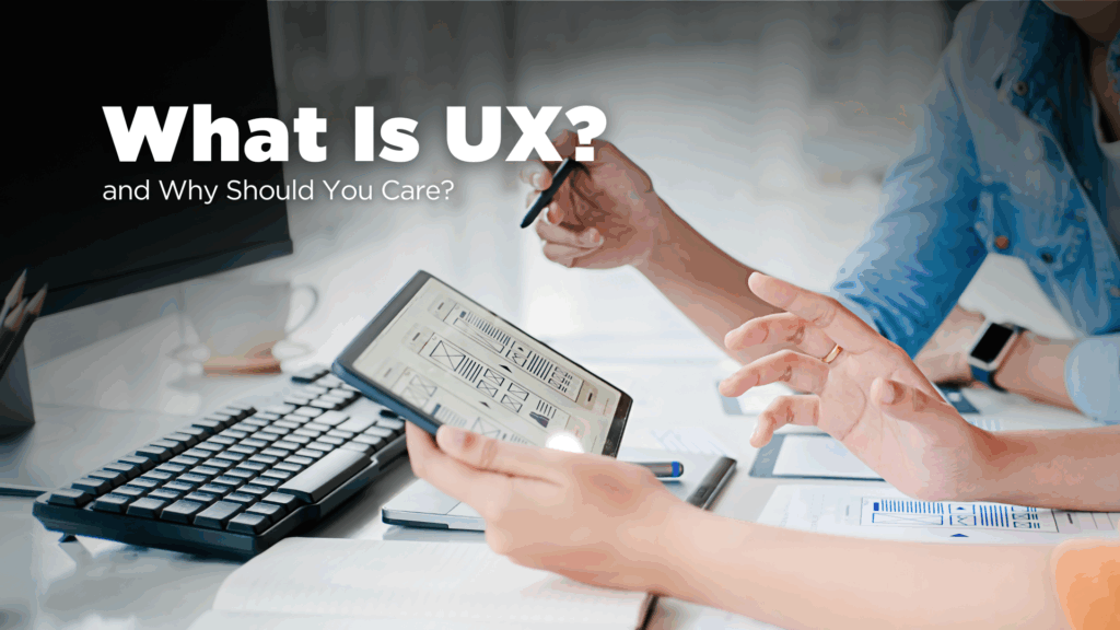 Two web designers looking at a UX design on a tablet.